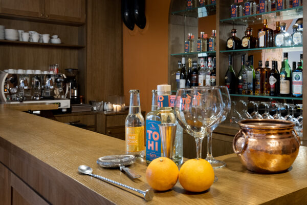 TOHI Cloudberry Mist Noridc Dry Gin on a distillery bar counter