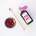 Tohi Aronia Infused Gin and aronia gin tonic cocktail with barspoon