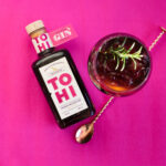 TOHI Aronia Infused Gin bottle and gintonic serving